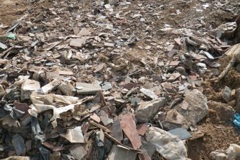 ASBESTOS WASTE BURIED ON FLOODPLAIN