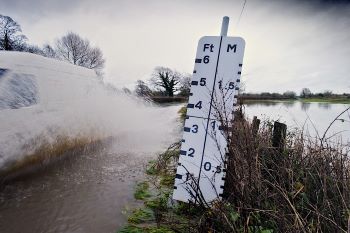 FLOODING Van driving through a flooded street