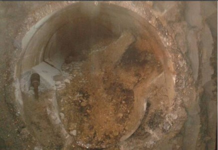 Concrete filled sewer