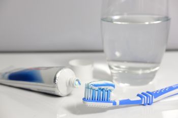 TOOTHBRUSH TOOTHPASTE GLASS OF WATER 1