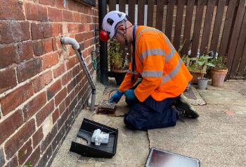 Yorkshire Water sewer-alarm-being-fitted-in-sheffield 1